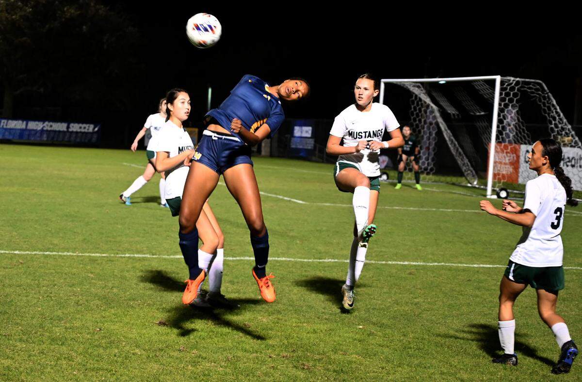 St. Thomas Aquinas sophomore Sophie Barnes fields a shot off her chest during the first half of a Class 6A state semifinal against Lakewood Ranch at Lake Myrtle Sports Complex on Thursday.