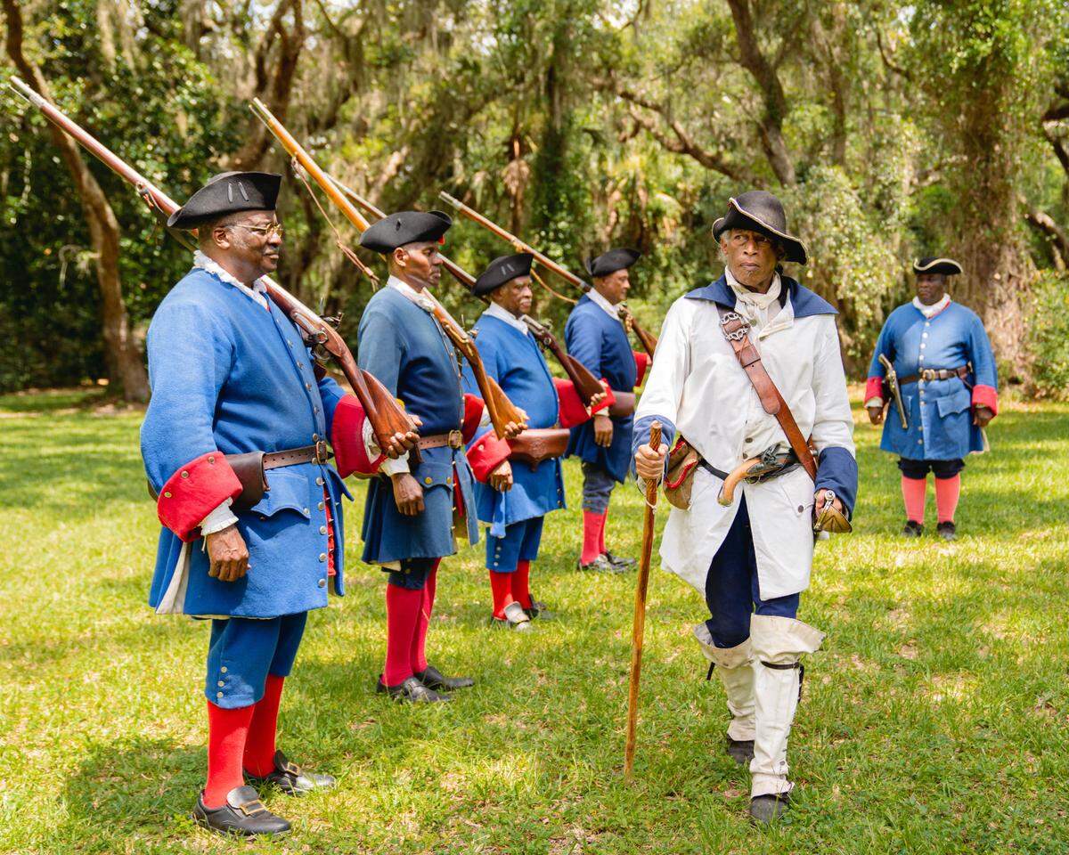 Soldiers reenact a battle at Fort Mose. Located just outside of St. Augustine, Fort Mose was the first free, Black settlement in what would become the United States of America.