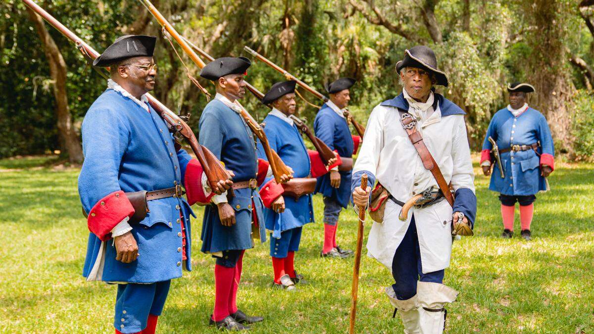 Soldiers reenact a battle at Fort Mose. Located just outside of St. Augustine, Fort Mose was the first free, Black settlement in what would become the United States of America.