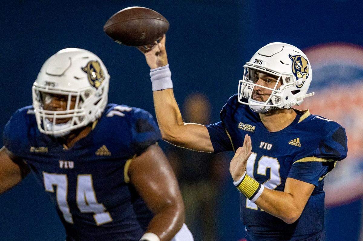 Florida International University quarterback Gunnar Holmberg (12) throws the ball down field during the first quarter of an NCAA Conference USA football game against Bryant University at Riccardo Silva Stadium in Miami, Florida, on Thursday, September 1, 2022.