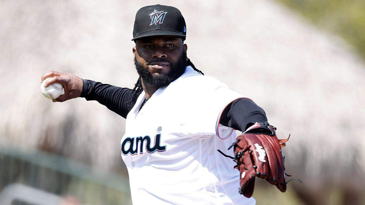 Miami Marlins starting pitcher Johnny Cueto (47) throws out St. Louis Cardinals Jose Fermin (35) in the second inning at Roger Dean Stadium on Feb. 26, 2023.