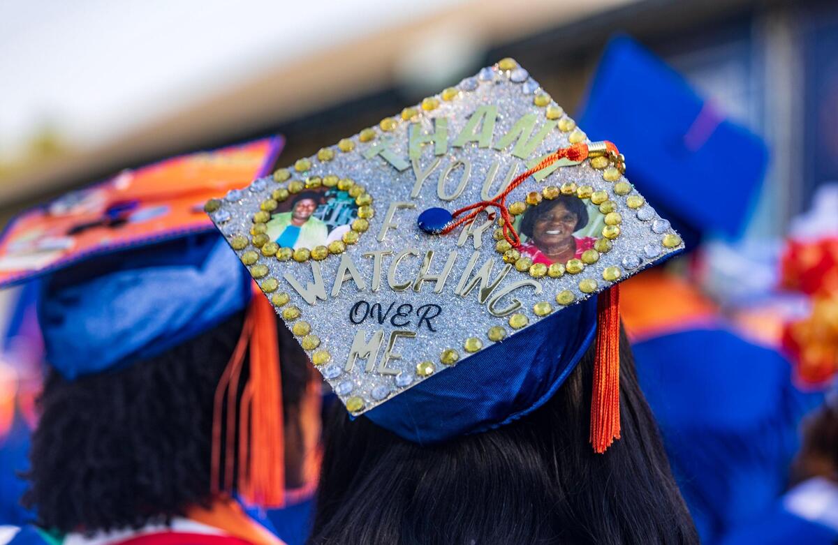 “Thank you for watching over me,” reads a bedazzled graduate’s cap, along with two photos of women, at the spring commencement ceremony at Florida Memorial University in Miami Gardens, on Saturday May 6, 2023.