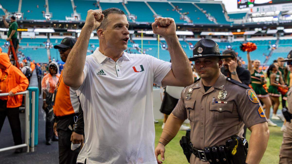 Miami Hurricanes head coach Mario Cristobal celebrates with fans after their win over the Duke Blue Devils during an ACC football game at Hard Rock Stadium on Saturday, Nov. 2, 2024, in Miami Gardens, Fla.