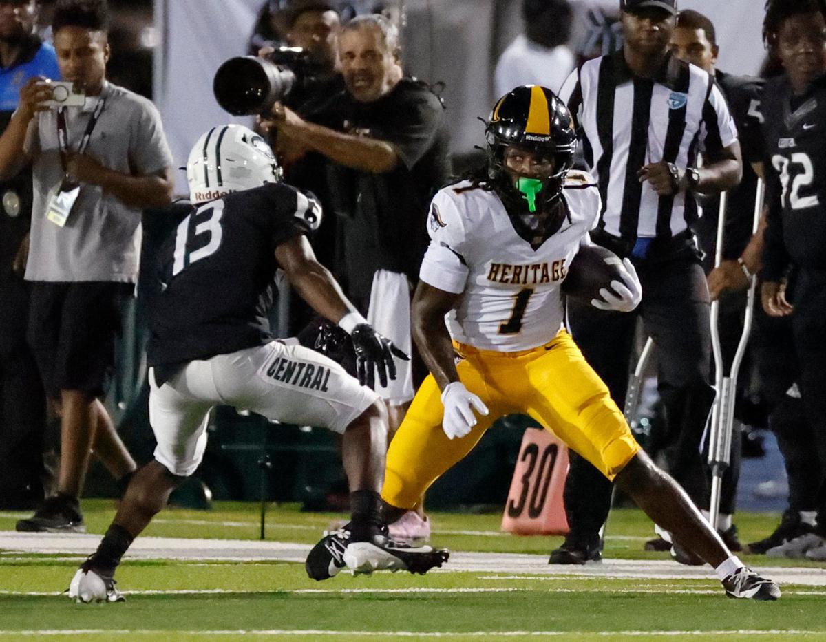 American Heritage High School’s wide receiver Malachi Toney (1) carries the ball on a reception as Central HIgh’s defensive back Jalen Labranche (13) defends in the first half at Traz Powell Stadium in Miami Friday, September 20, 2024.