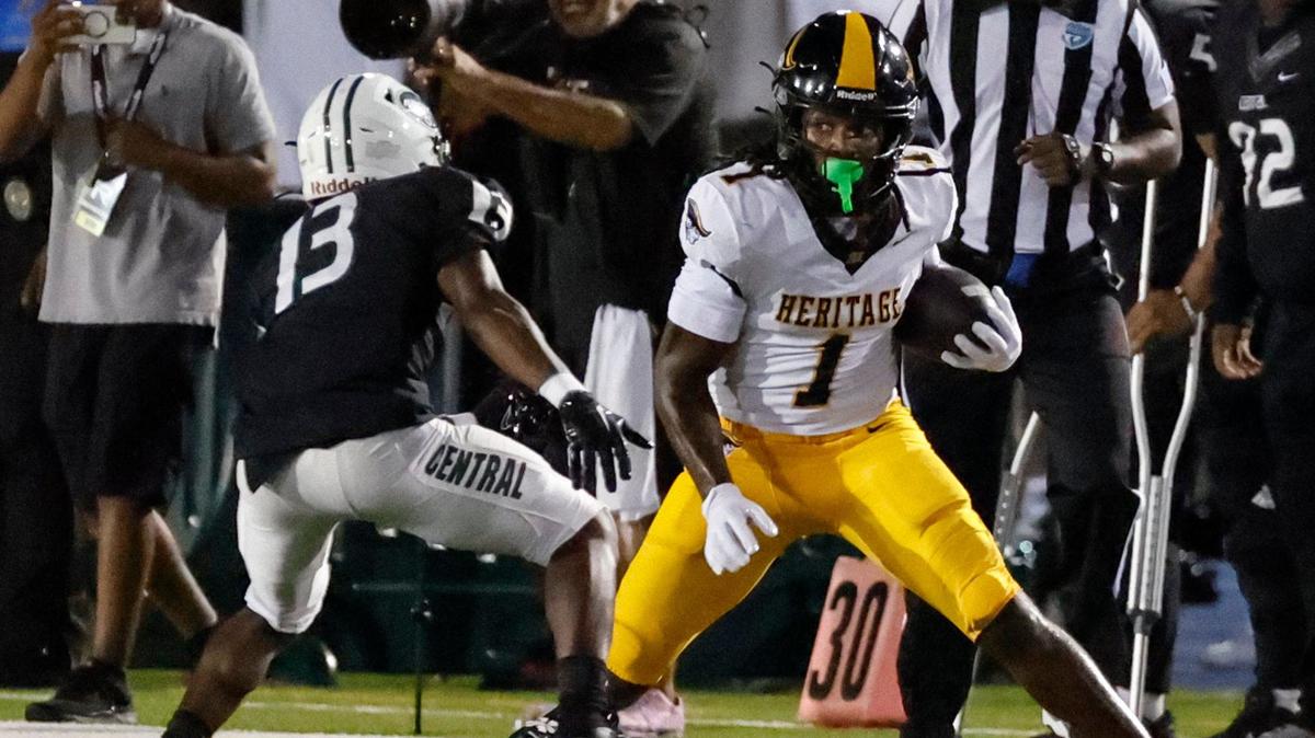 American Heritage High School’s wide receiver Malachi Toney (1) carries the ball on a reception as Central HIgh’s defensive back Jalen Labranche (13) defends in the first half at Traz Powell Stadium in Miami Friday, September 20, 2024.