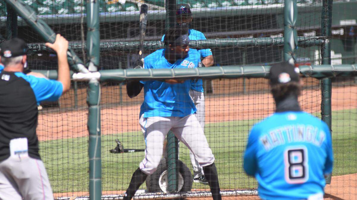 Miami Marlins outfielder Lewis Brinson goes through a round of batting practice at the Roger Dean Chevrolet Stadium complex on Saturday, Feb. 27, 2021, in Jupiter, Florida.