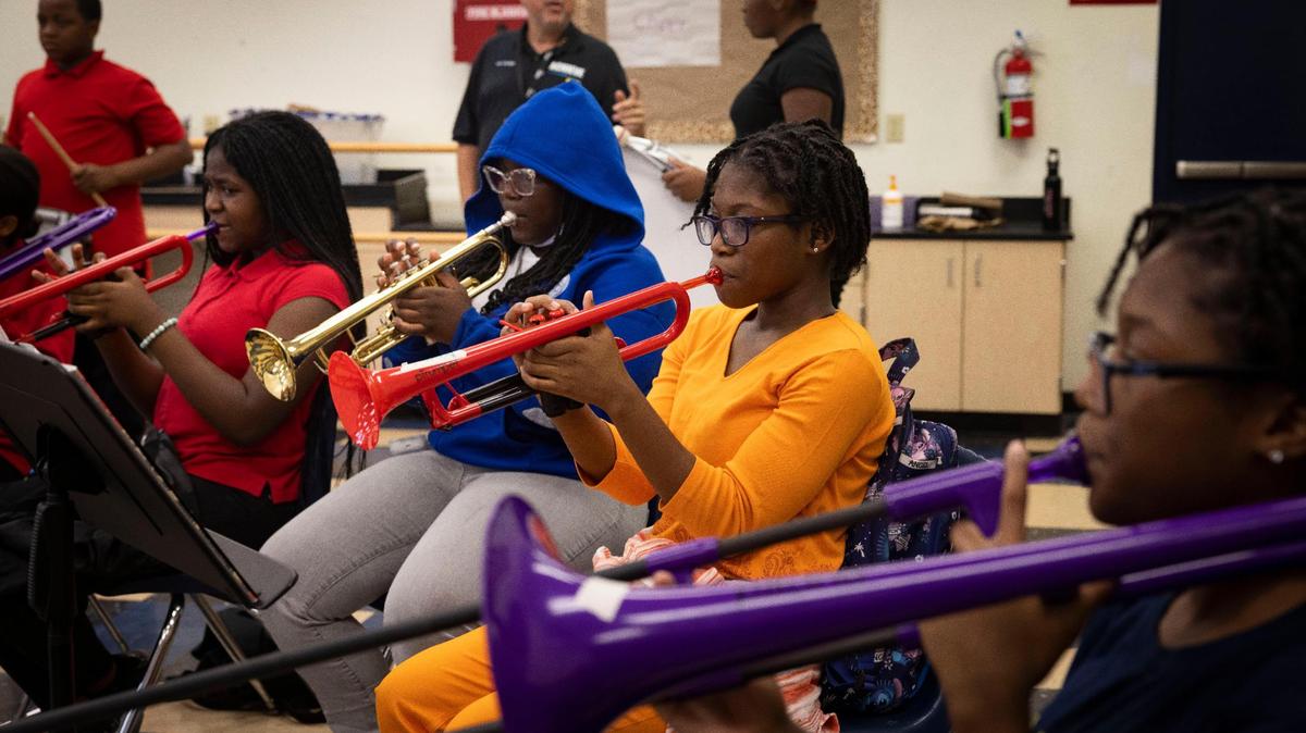 The trumpet section plays their part in a song during the middle school Achieve Miami afterschool program, a free music program for kids, on Wednesday, Oct. 18, 2023, at Caribbean K-8 Center in Miami.