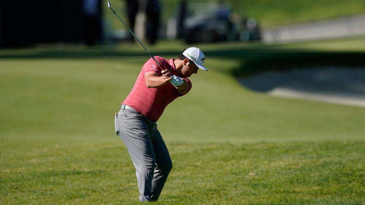 Jon Rahm hits his second shot on the second hole during the final round of the Genesis Invitational golf tournament at Riviera Country Club, Sunday, Feb. 21, 2021, in the Pacific Palisades area of Los Angeles.