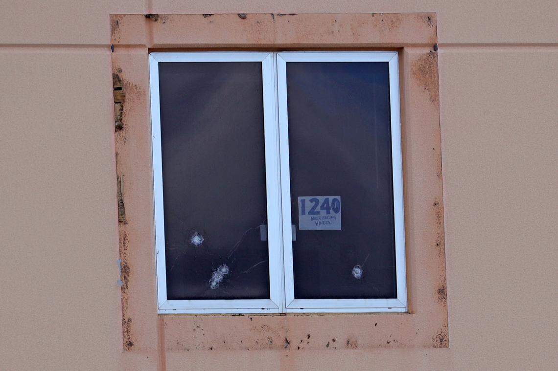 A sign reading “1240 west facing window” and five bullet holes can be seen in a third floor window of the “1200 building,” the crime scene where the 2018 shootings took place, at Marjory Stoneman Douglas High School in Parkland. On Thursday, jurors, followed later by a small group of media, toured the crime scene as part of the ongoing trial to decide whether confessed shooter Nikolas Cruz should be executed or sentenced to life in prison.