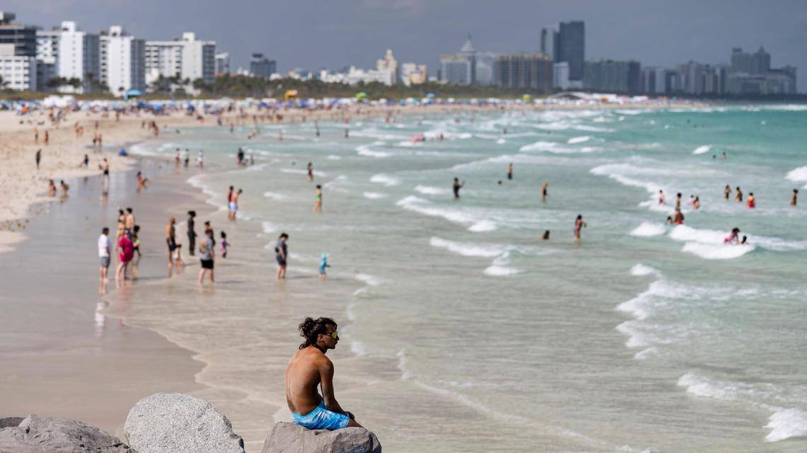 People visit South Pointe Beach during spring break on Saturday, March 15, 2025, in Miami Beach, Fla.