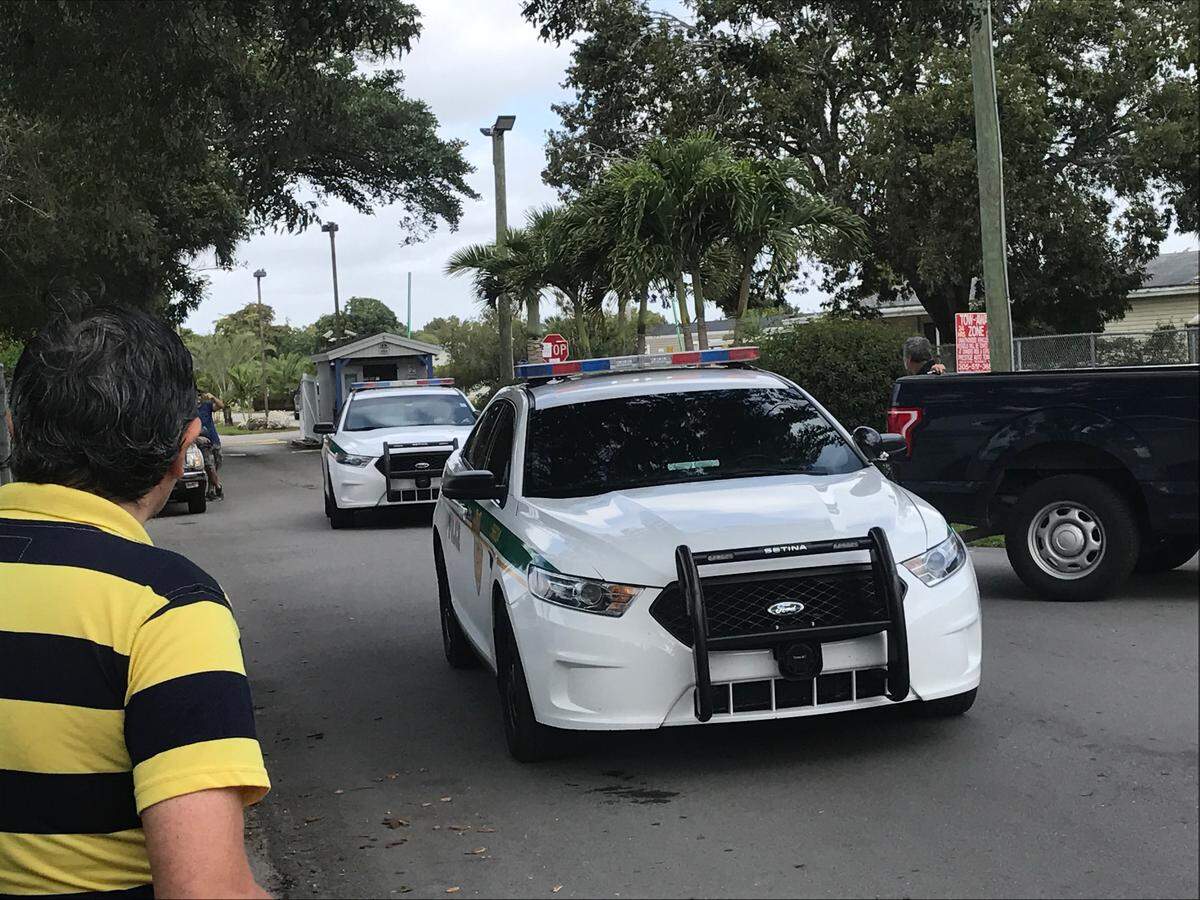 Miami-Dade police cars leaving Americana Village after Tuesday’s incident ended.