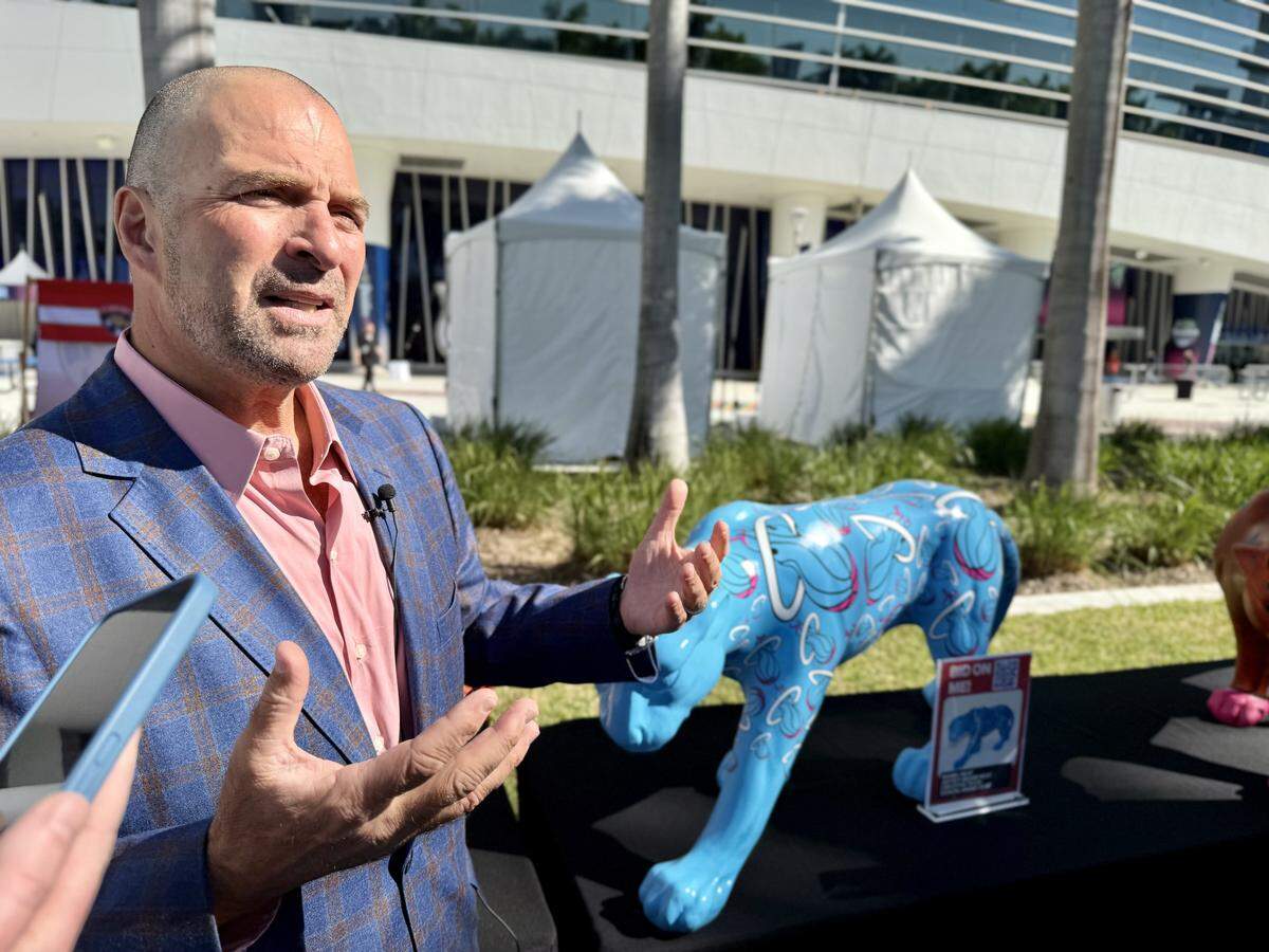 Florida Panthers president of hockey operations and general manager Bill Zito speaks about his Panthers on the Prowl fundraiser on Jan. 2 outside loanDepot Park before the Winter Classic in Miami.