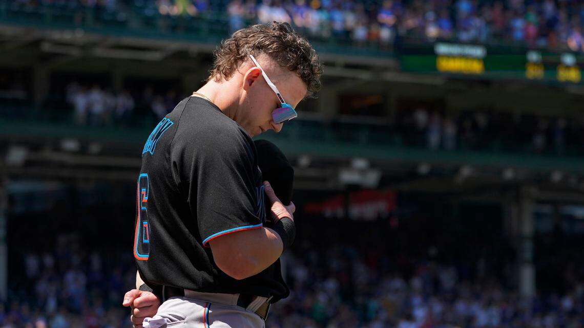 Miami Marlins’ Peyton Burdick stands for the national anthem in his Major League debut in a baseball game against the Chicago Cubs Friday, Aug. 5, 2022, in Chicago. (AP Photo/Charles Rex Arbogast)