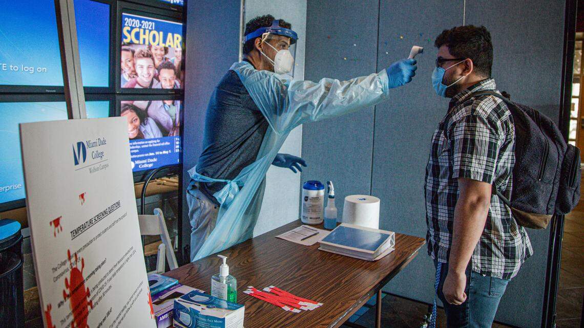 MDC students and staff get the temperature checked when they arrive to the Wolfson Campus checkpoint on June 23, 2020.