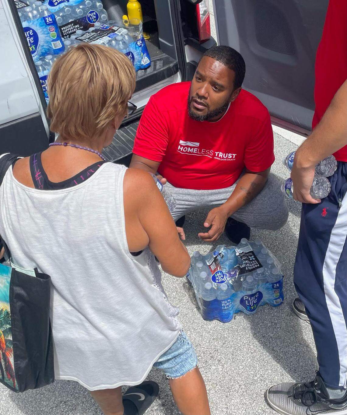 Denny Baldonado, an outreach worker for the Miami-Dade Homeless Trust, helps deliver water and other supplies to individuals living on the streets when the heat index in Miami-Dade County soars to 105 degrees and above.