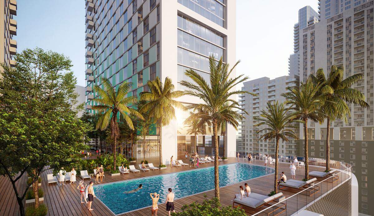 The project includes a total of 1,200 residential units. A rendering shows the project’s amenity deck and pool.