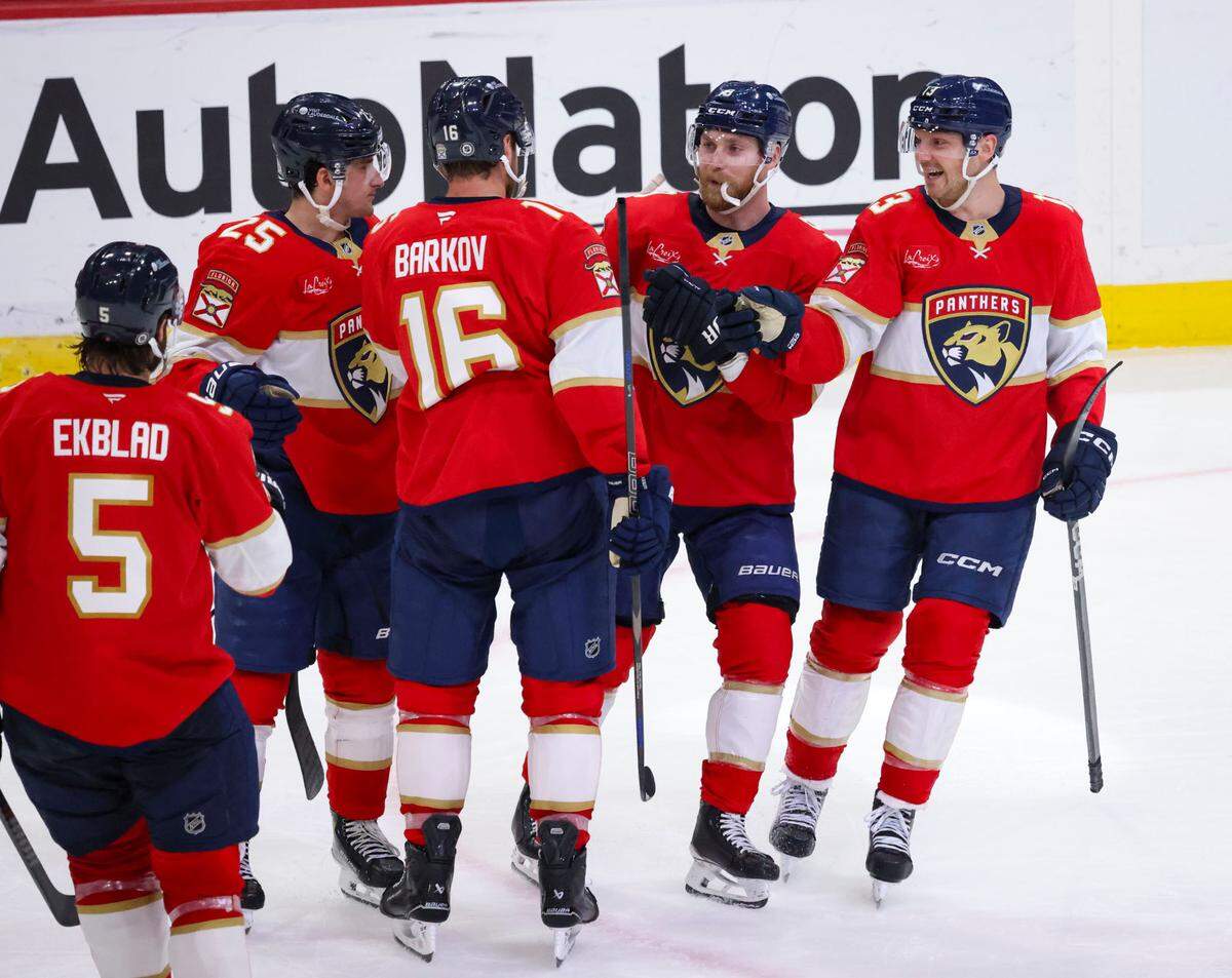 Florida Panthers teammates highfive Florida Panthers center Aleksander Barkov (16) after scoring a second goal during the second period of a game against the Tampa Bay Lightning on Monday, March 3, 2025, at Amerant Bank Arena in Sunrise, Fla.