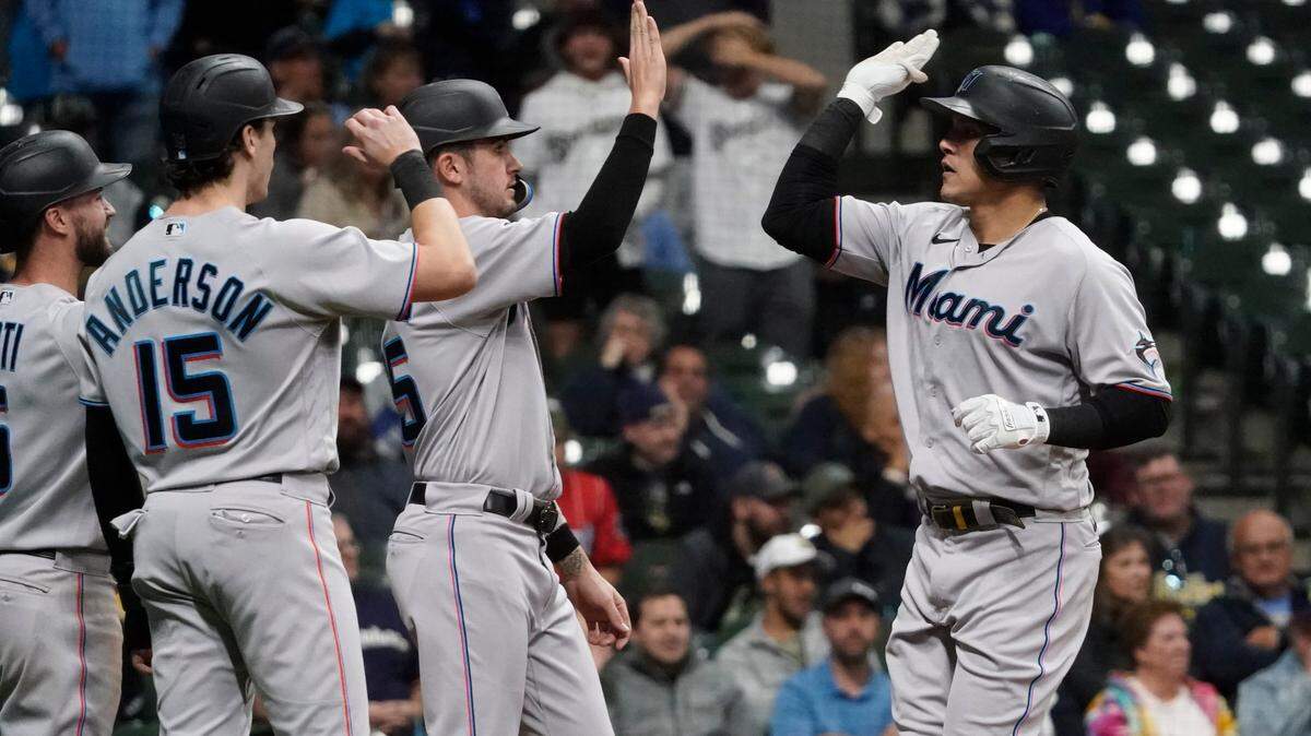 Miami Marlins’ Avsail Garcia is congratulated after hitting a grand slam during the eighth inning of a baseball game against the Milwaukee Brewers Thursday, Sept. 29, 2022, in Milwaukee. (AP Photo/Morry Gash)