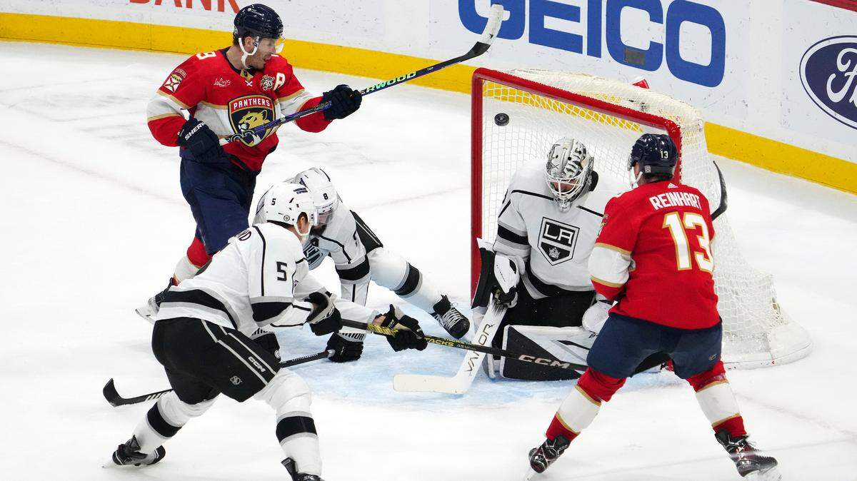 Jan 11, 2024; Sunrise, Florida, USA; Florida Panthers center Sam Reinhart (13) scores the game winning goal past Los Angeles Kings goaltender Cam Talbot (39) with 00.7 seconds left in the overtime period at Amerant Bank Arena. Mandatory Credit: Jasen Vinlove-USA TODAY Sports