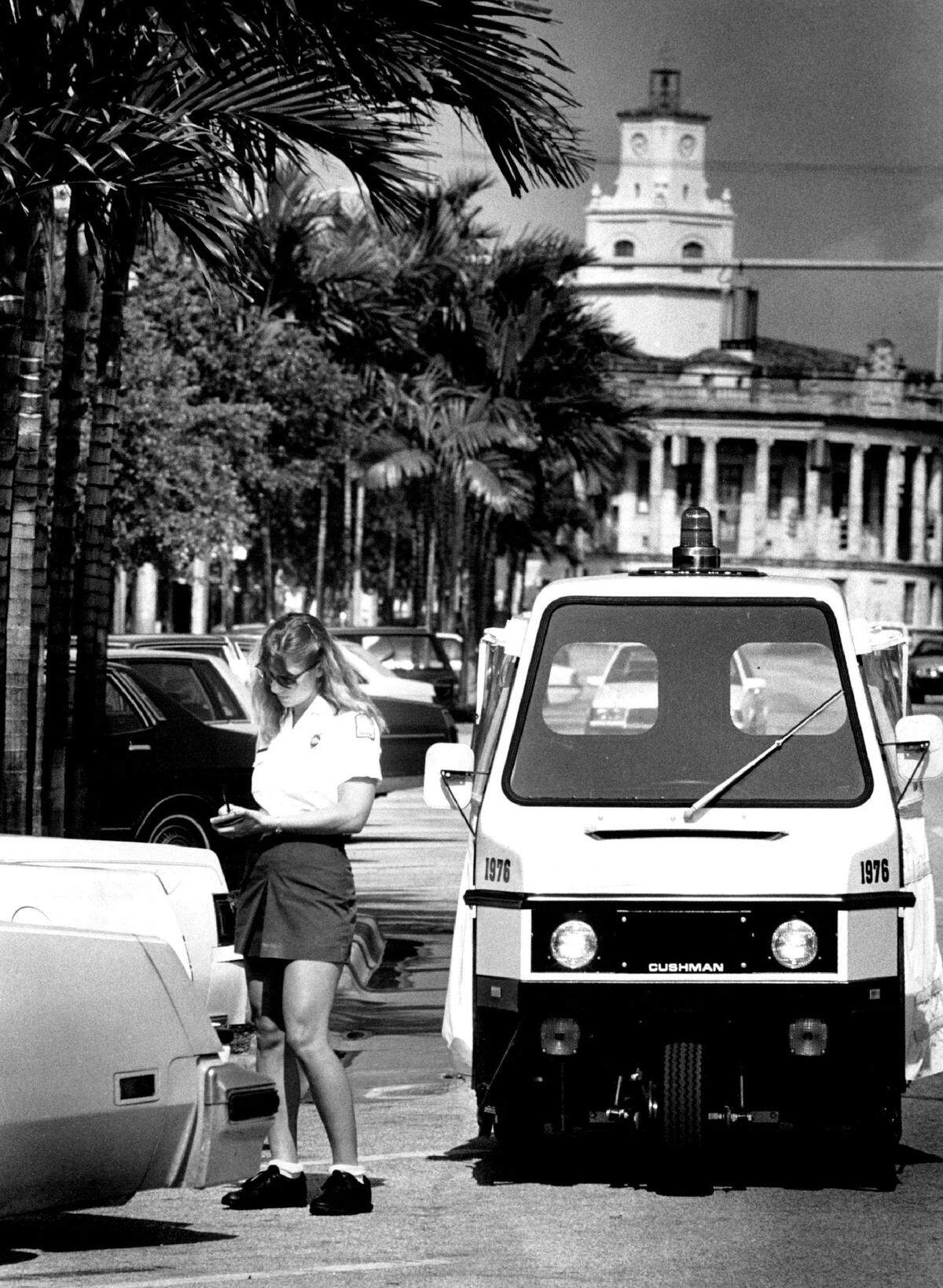 Maybe some things don’t change. A parking enforcer writes a ticket in 1988 along Miracle Mile.