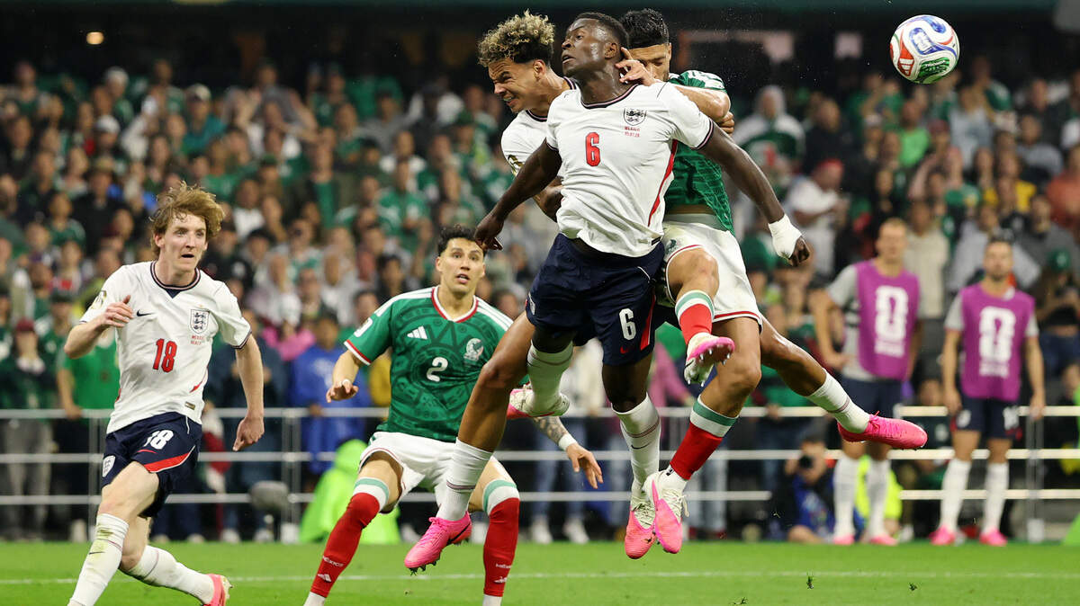 MEXICO CITY, MEXICO - JULY 05: Raul Jimenez #9 of Mexico competes for a header against Nico O'Reilly #3 and Marc Guehi #6 of England during the FIFA World Cup 2026 Round of 16 match between Mexico and England at Mexico City Stadium on July 05, 2026 in Mexico City, Mexico. O’Reilly and Guehi are Manchester City teammates of Norway’s Erling Haaland (Photo by Charlotte Wilson/Getty Images)