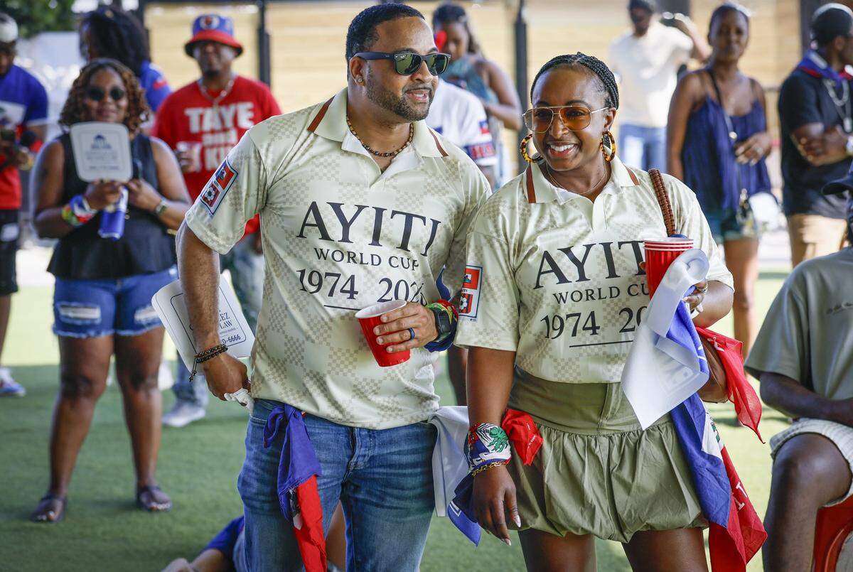 Terry and Yolvanie Maximilien wear World Cup attire while attending the 28th Annual Haitian Compas Festival at The NoMI Village celebrating Haitian Flag Day, in North Miami, Florida on Saturday, May 16, 2026.
