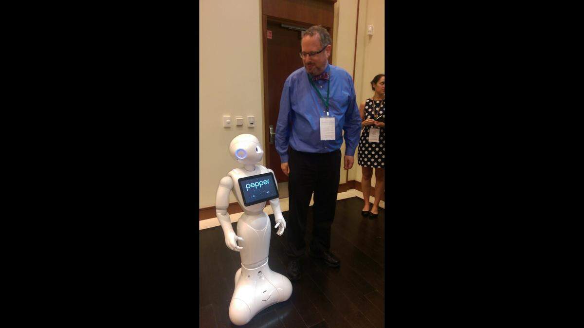 A. Michael Froomkin, co-founder of We Robot, with AI Robot Pepper at the​ 2016 conference at the University of Miami School of Law.