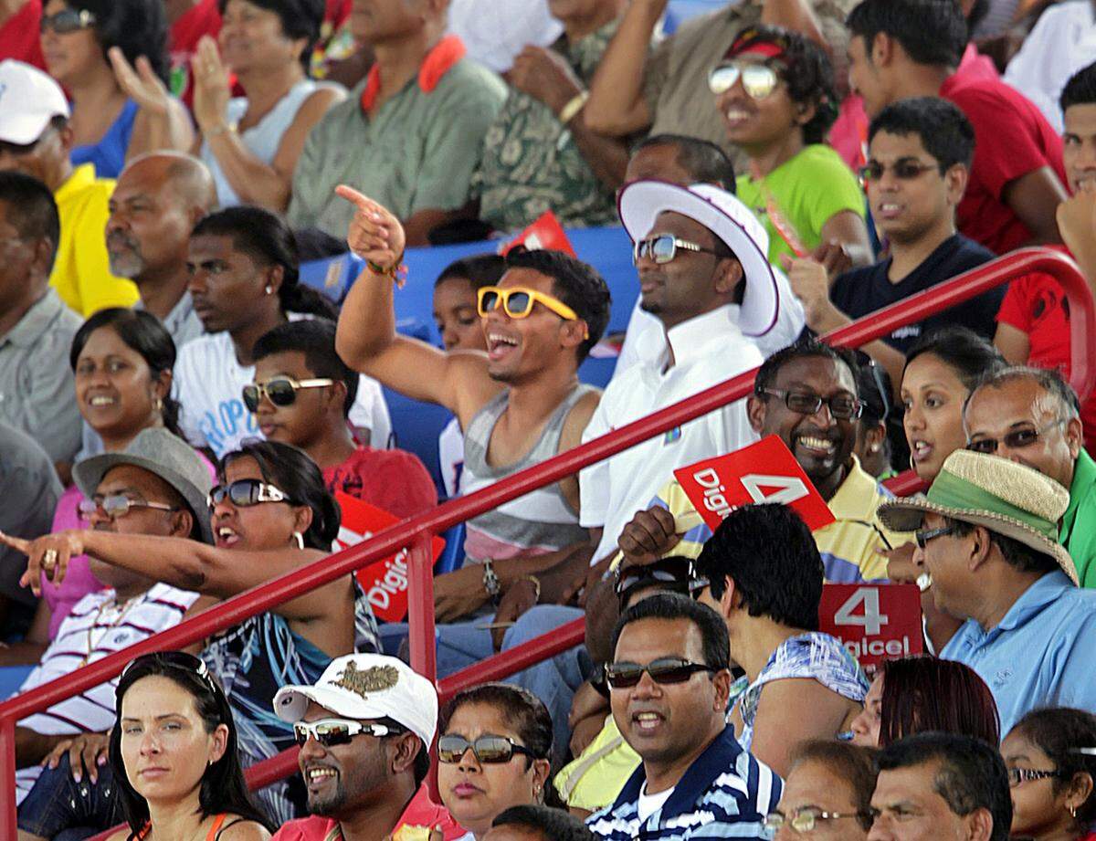West Indies fans react gleefully during their team’s strong at-bat against New Zealand on Saturday June 30, 2012 in Lauderhill. The match was the first sanctioned cricket match to take place in the United States. West Indies won the match, at Broward County’s Central Broward Regional Park.