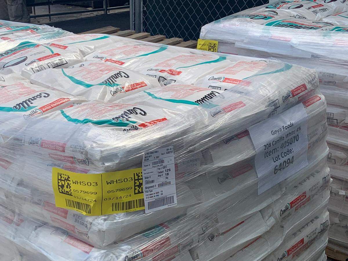 Pallets of Canilla Extra Long Grain Enriched White Rice from Goya Foods on West 18th Lane behind the Hialeah Price Choice Foodmarket.