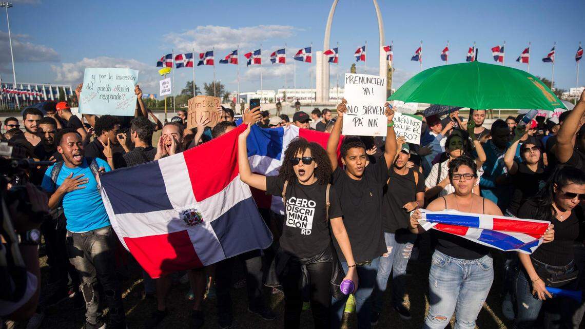 People demonstrate outside the Central Electoral Board (JCE) in Santo Domingo on February 17, 2020, a day after electronic voting systems failed forcing authorities to suspend municipal elections across the country.