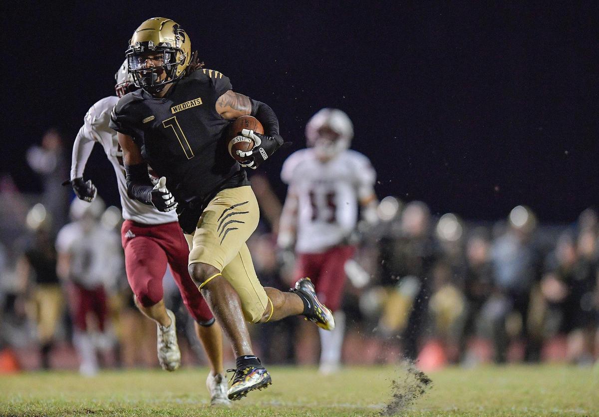 Western receiver Jullian Lewis runs for the endzone after catching a pass against the Stoneman Douglas defense during the first half of their game, Friday, November 11, 2021.