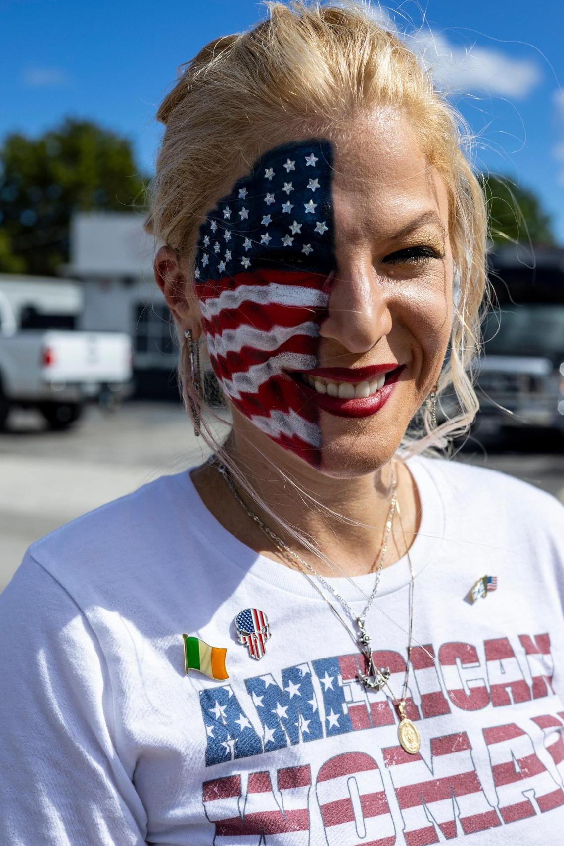 Clemeen Connolly shows off her two-hour face painting creation of a waving American flag. On the night of the RNC debate in Miami, former President Donald Trump holds a rally in Hialeah, November 8, 2023.