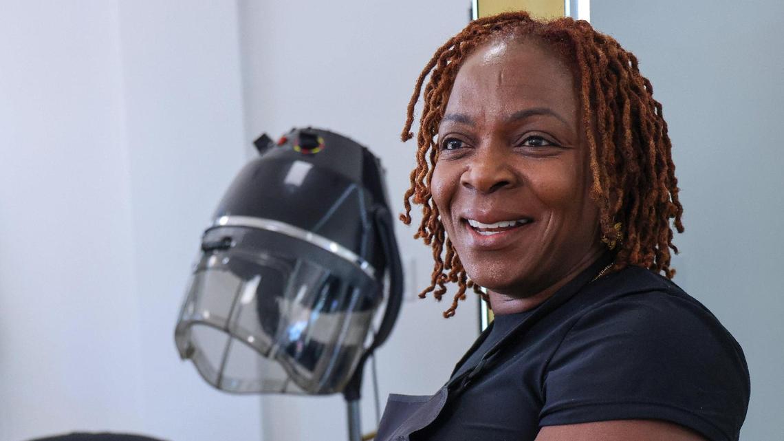Hairstylist and beautician Nicole Ward sits at Prestige Beauty Salon, where she has operated for the past 14 years, and is content with her location at Cloverleaf Plaza in Miami Gardens, Florida, on Thursday, March 6, 2025. Artist Flo Ride born as Tramar Lacel Dillard and his business partner Lee Prince purchased a development on the border of Miami Gardens, which has been promoted as the city’s first Black-owned plaza.