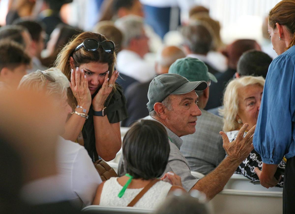 Family and friends arrive for a public memorial event to mark the one-year anniversary on Friday, June 24, 2022, of the collapse of Champlain Towers South in Surfside, Florida.
