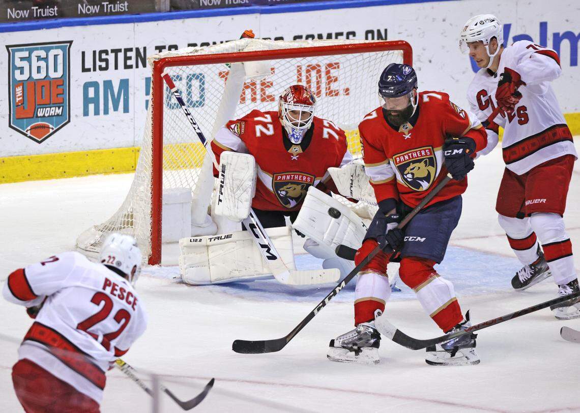 Florida Panthers goaltender Sergei Bobrovsky (72) and Panthers defenseman Radko Gudas (7) defend the goal from Carolina Hurricanes defenseman Brett Pesce (22) and Hurricanes right wing Jesper Fast (71) during the second period of their NHL game at the BB&T Center on Thursday, April 21, 2021 in Sunrise, Fl.