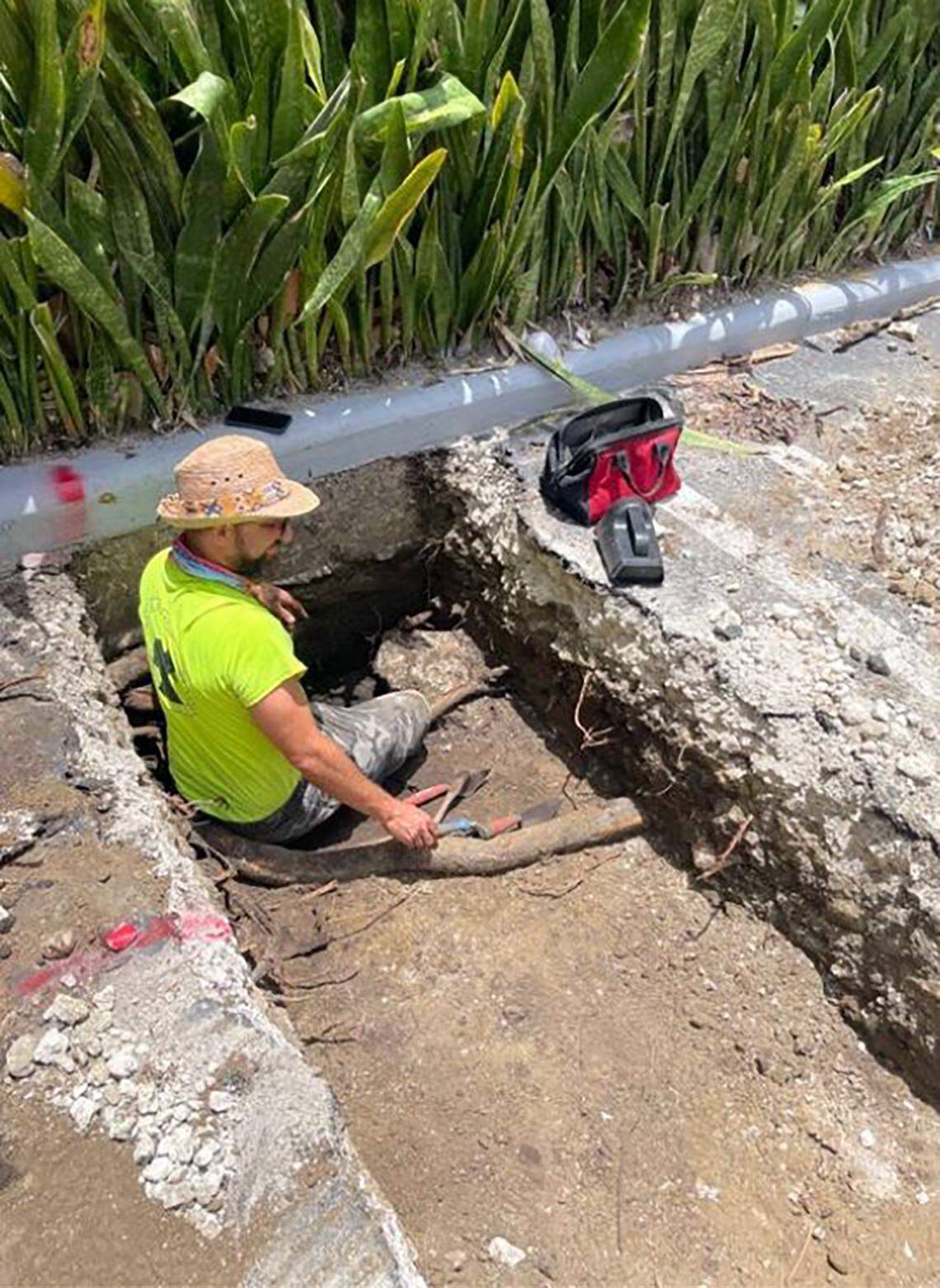 In a photo from a previously undisclosed October 2024 report submitted to the city of Miami, an archaeological worker digs at 1809 Brickell Avenue, the location of a significant discovery of an indigenous burial and settlement site dating back some 3,500 years.