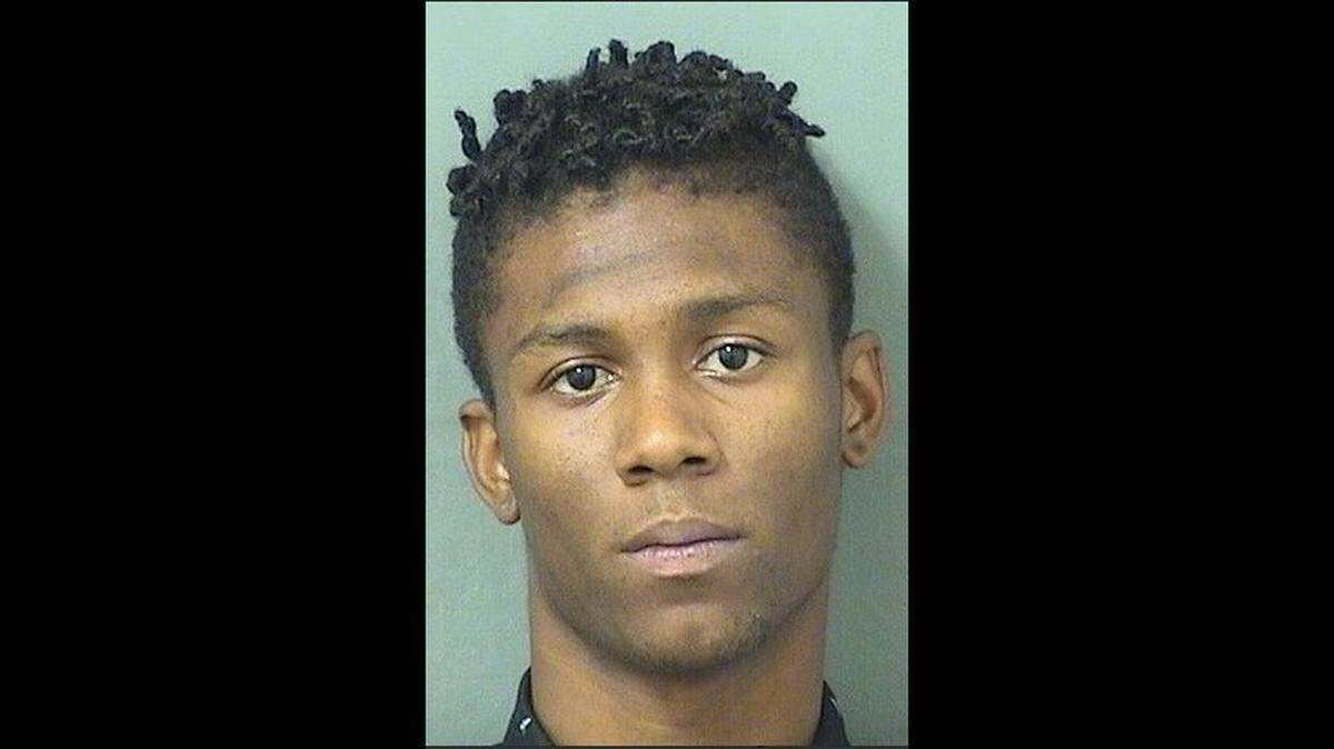 Xavier Martin, 19, of West Palm Beach has been charged with four counts of aggravated assault with a deadly weapon without intent to kill and one charge of possessing a weapon on school property after police say he showed his gun to a group of praying football students on the grounds of Palm Beach Lakes Community High School.