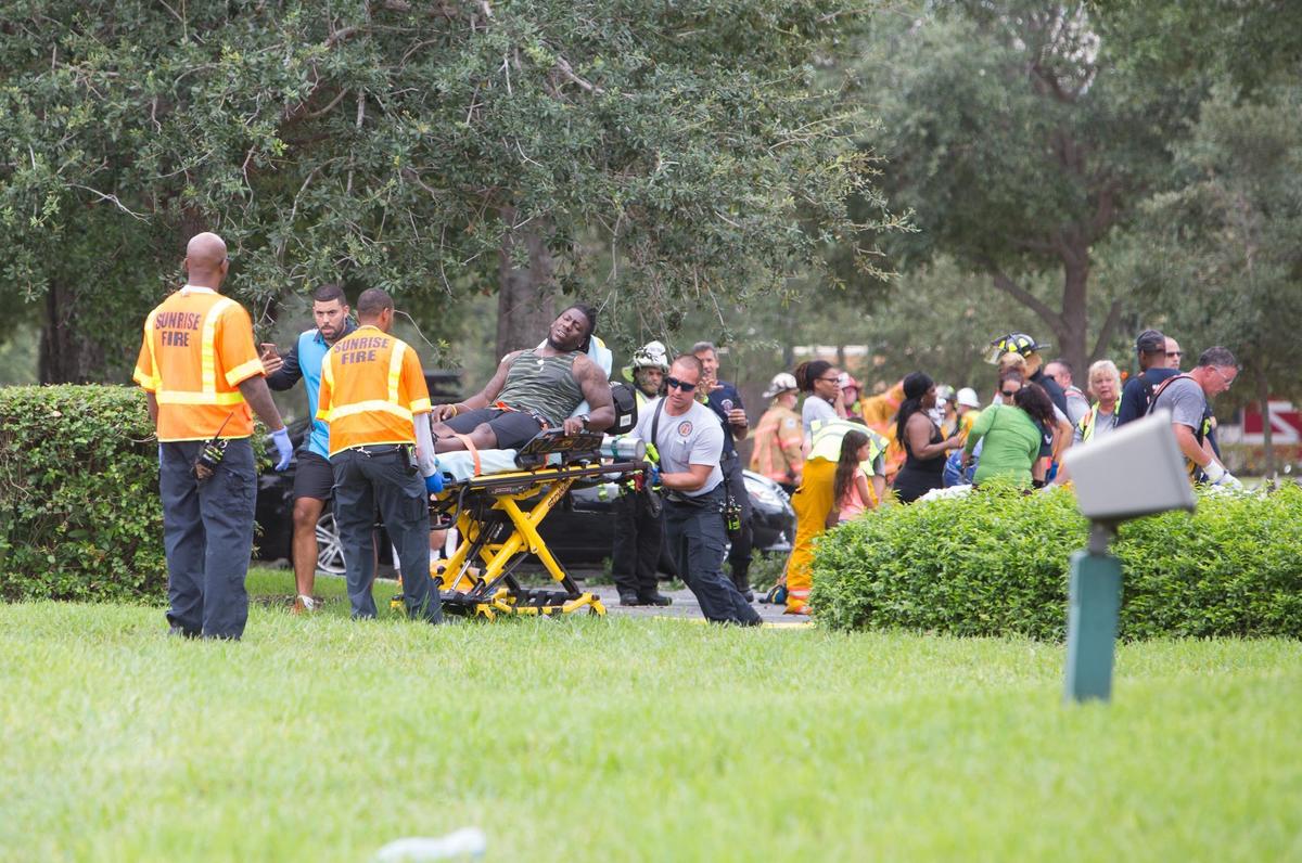 A man is carried out on a strecher by fire rescue personnel after an explosion injured multiple people at the Fountain shops in Plantation on Saturday, July 6, 2019.