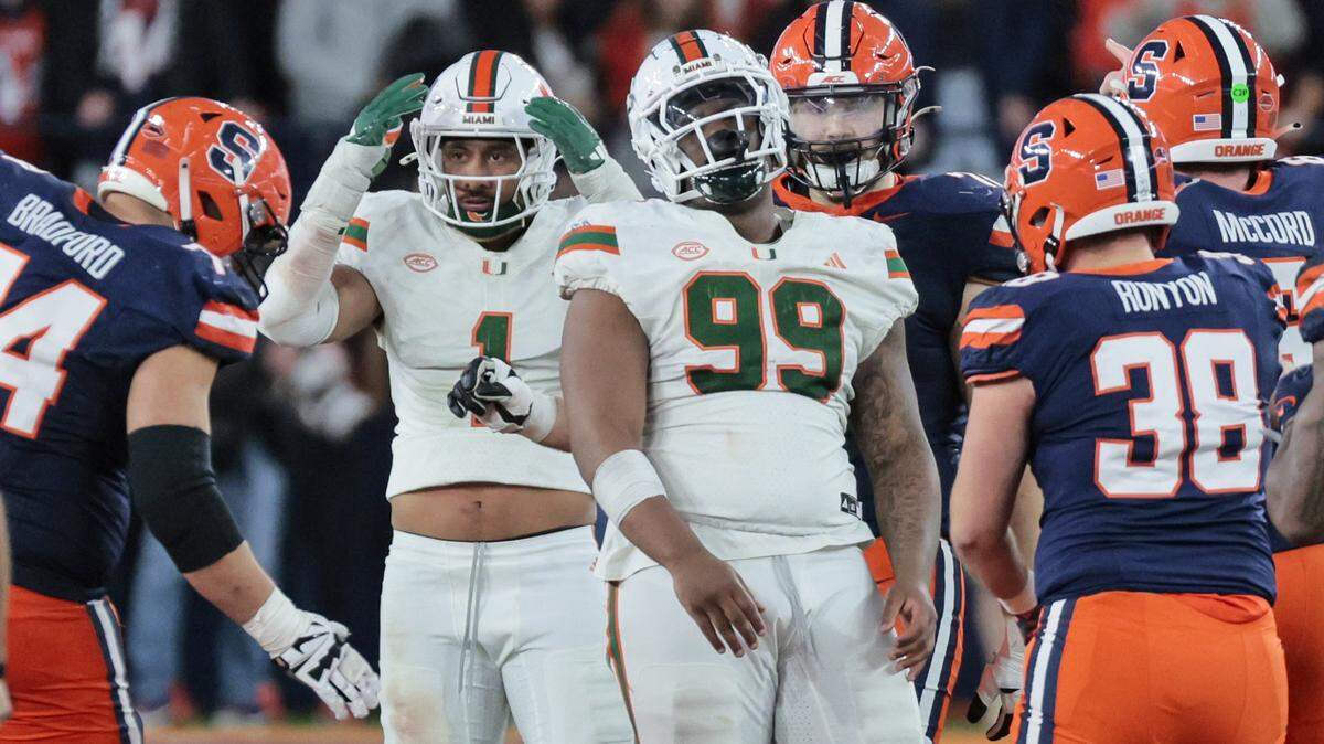 Miami Hurricanes linebacker Francisco Mauigoa (1) reacts after a penalty is called on Miami Hurricanes defensive lineman Ahmad Moten Sr. (99) late in the second half during their NCAA football game against the Syracuse Orange in the JMA Wireless Dome at Syracuse University, Syracuse, New York on Saturday, November 30, 2024.
