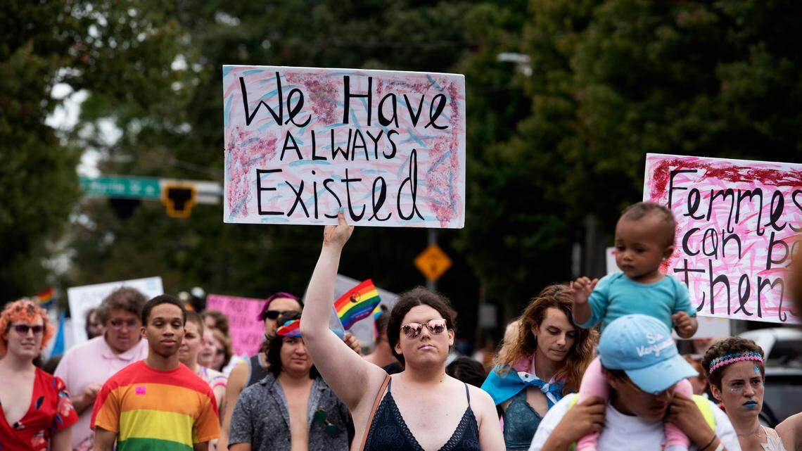 Transgender and nonbinary individuals and their allies walk through Atlanta during Gay Pride’s Transgender Rights march on Oct. 12, 2019.