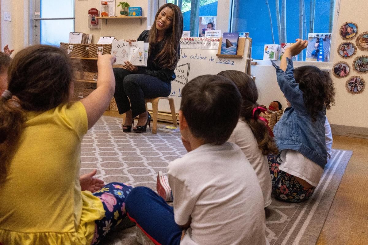 Symeria T. Hudson, center, the new CEO and president of United Way Miami, reads to 3- and 4-year-olds at the United Way Center for Excellence in Early Education on Wednesday, Oct. 19, 2022.
