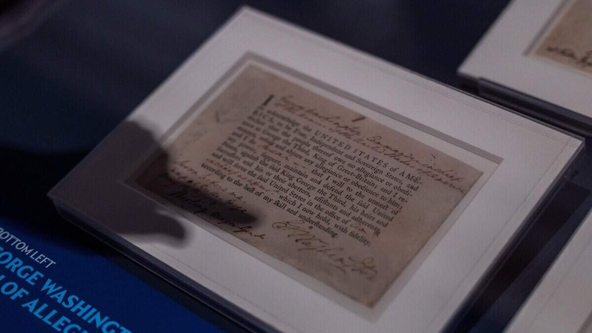 Jesse Katz, historian at the National Archives, points to a George Washington's signature during a press preview of the “Documents that Forged a Nation” exhibit while pointing to a historical document at the Museum of Miami in Miami, Fla., on Wednesday, June 17, 2026.