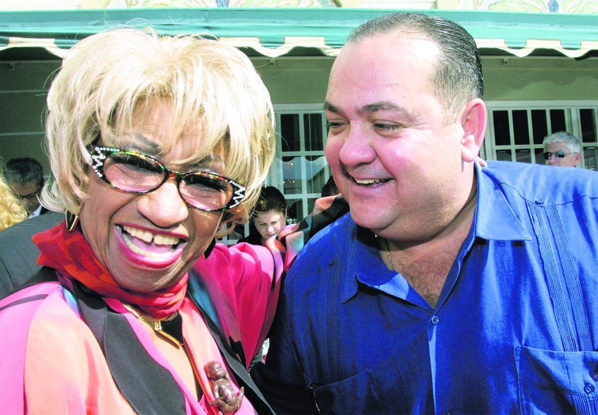 Celia Cruz and photographer Carlos M. Guerrero were at Versailles for the launch of the book, “Cubantime,” in November 2001.