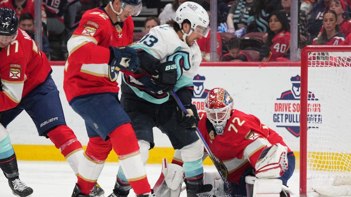 Feb 22, 2025; Sunrise, Florida, USA; Florida Panthers goaltender Sergei Bobrovsky (72) makes a save on Seattle Kraken left wing Brandon Tanev (13) in the first period at Amerant Bank Arena.