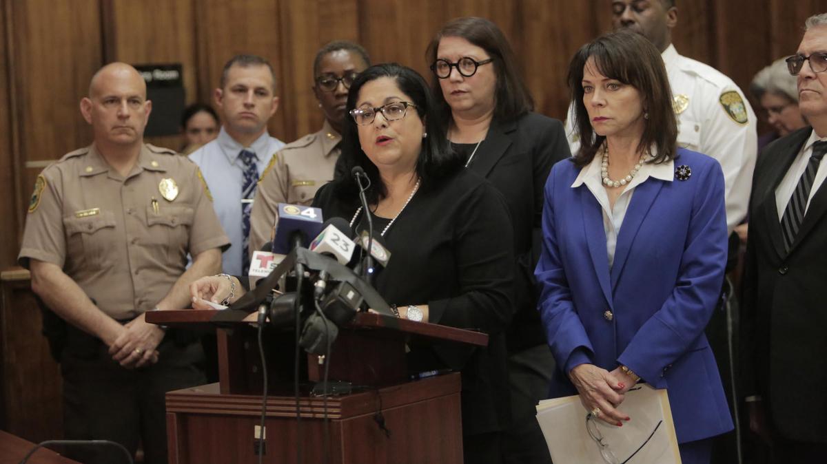 Bertila Soto, Chief Judge for the 11th Judicial Circuit, center, and other officials address the media on March 13, 2020, at a press conference to discuss criminal justice changes in response to the COVID-19, the disease caused by the coronavirus. It took place at the Richard E. Gerstein Justice Building at 1351 NW 12th St. in Miami.
