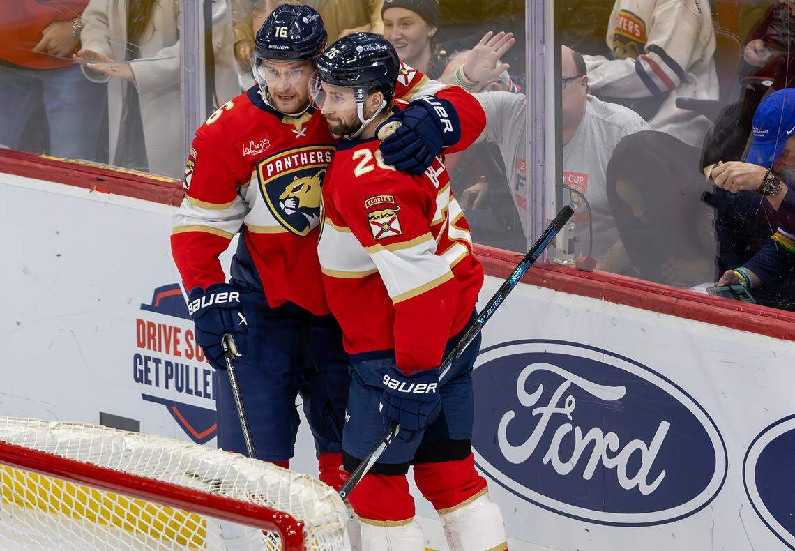Florida Panthers defenseman Uvis Balinskis (26) celebrates with teammate Aleksander Barkov (16) during the second period of an NHL game against the St. Louis Blues at Amerant Bank Arena on Friday, Dec. 20, 2024, in Sunrise, Fla.