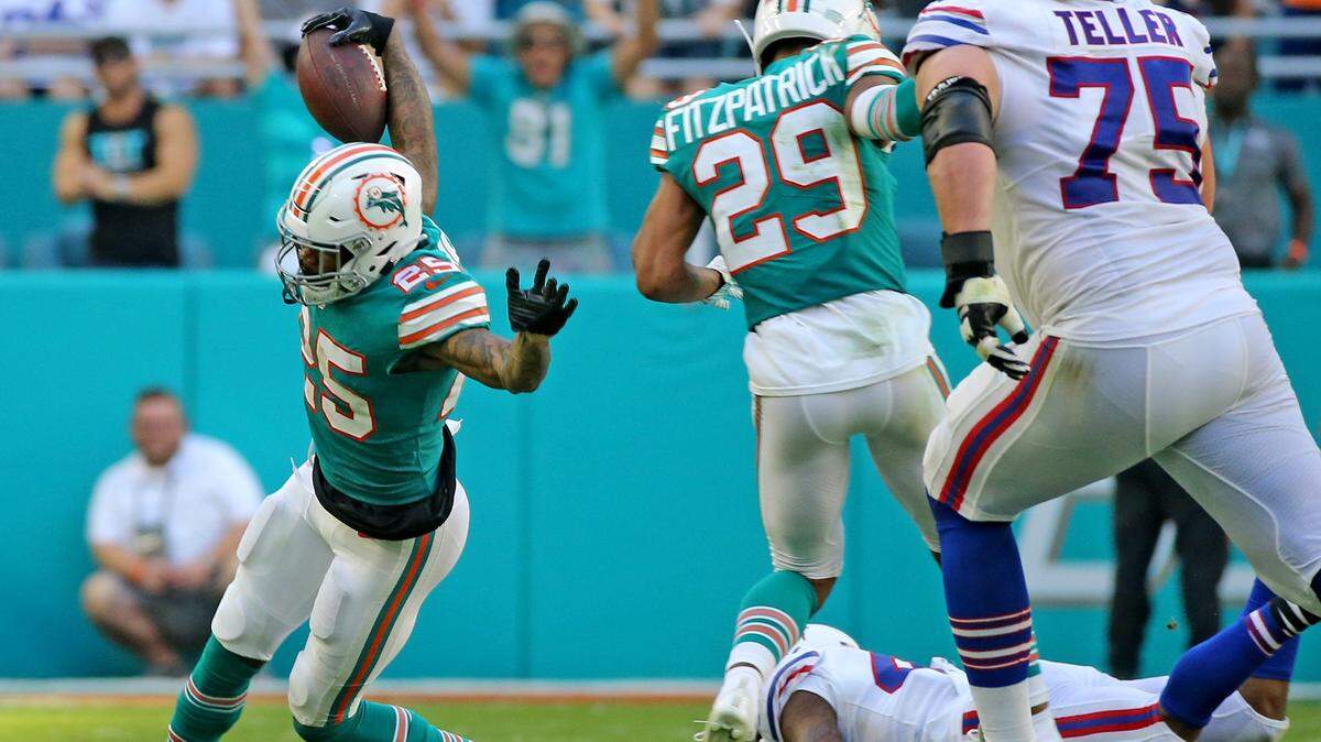 Dolphins corner Xavien Howard celebrates after interception Bills quarterback Josh Allen in the first half Sunday.