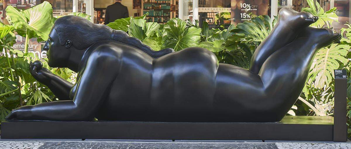 Fernando Botero’s “Donna Sdriata with fruit” is one of 13 monumental Botero bronzes installed on Lincoln Road, courtesy of the Nader Museum.