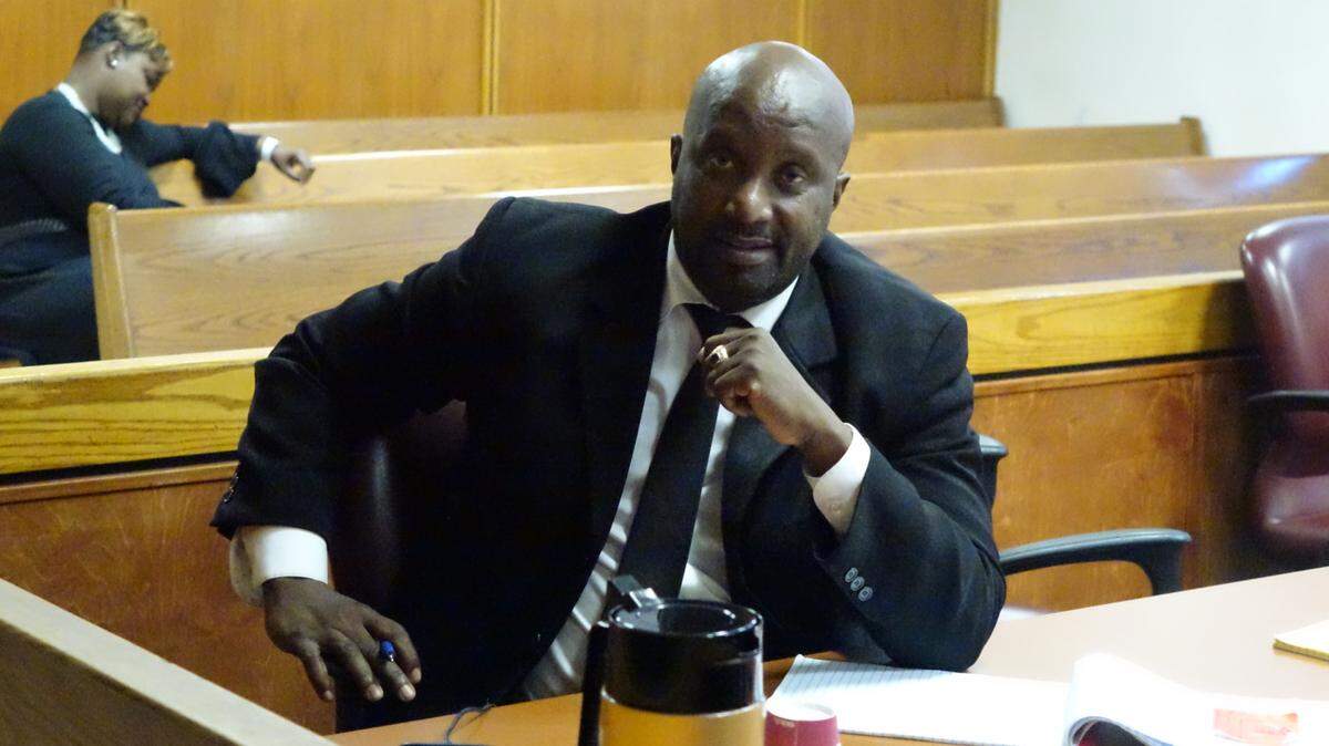 Former North Miami Adult Education Center Principal Jean Ridore poses for a photo in court while on trial for corruption. A jury late Friday convicted him.