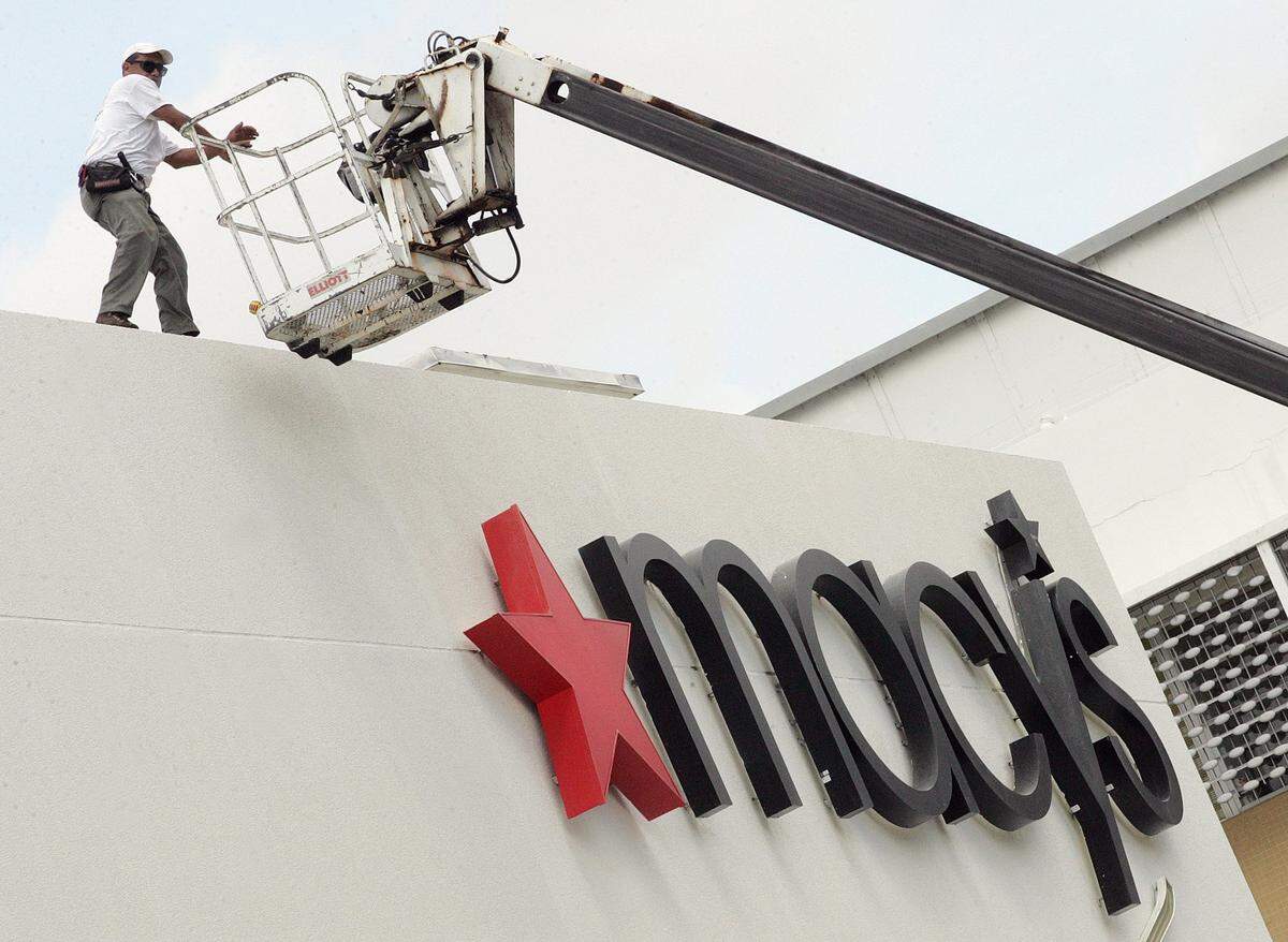 In 2007, workers check the Macy’s sign at the renovated store in Miami Beach near Lincoln Road..